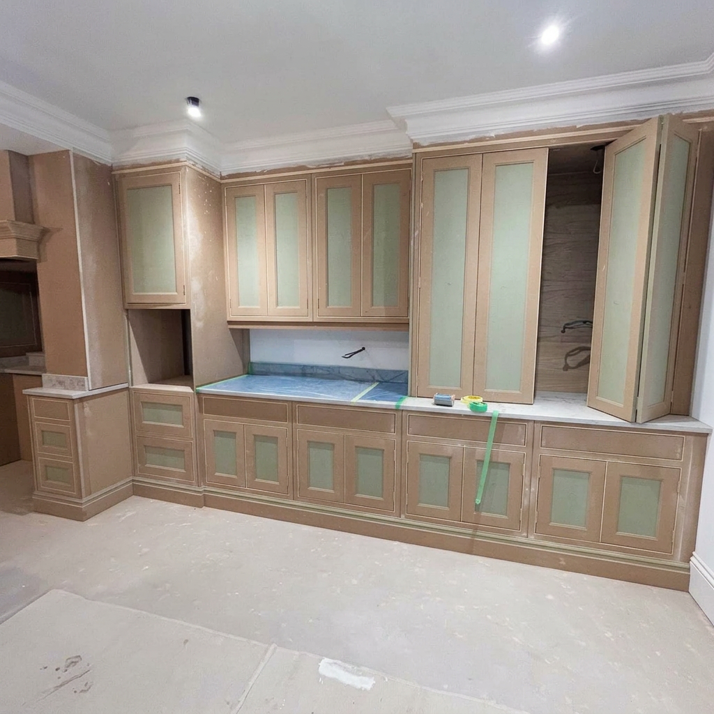 Kitchen cabinets primed and masked before spraying